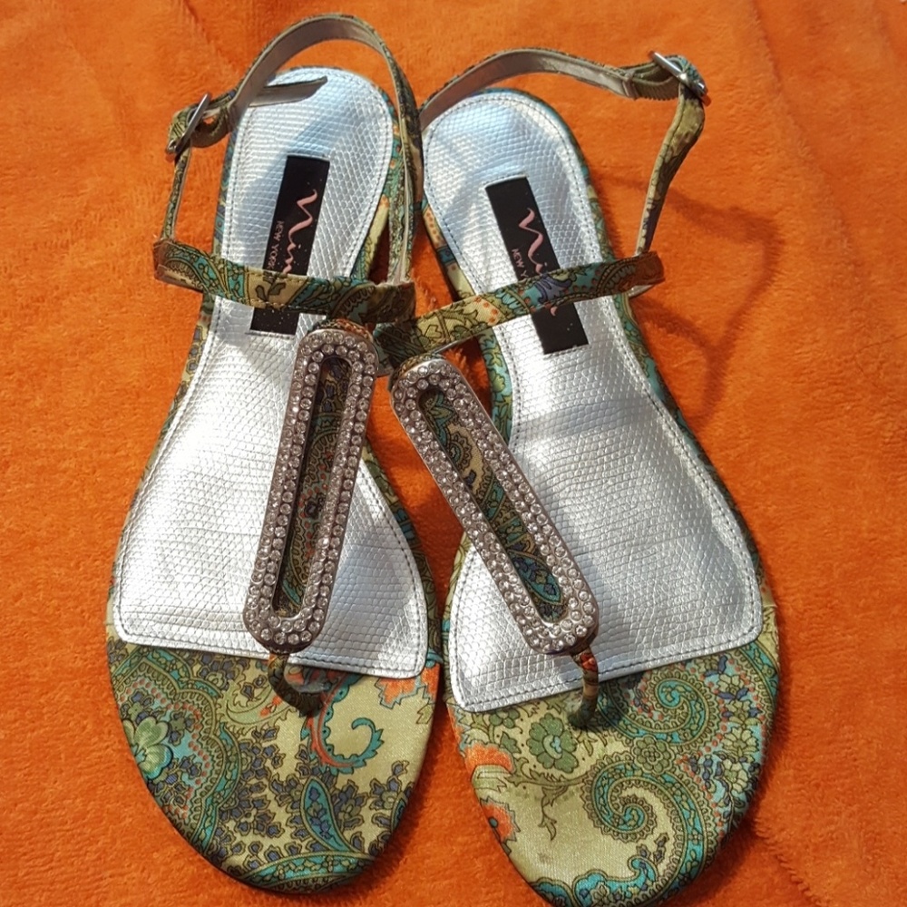 05:04 - NINA embellished T strap Sandals